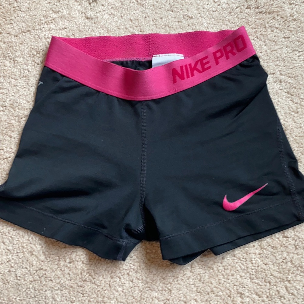 Pink and black Nike Pros
